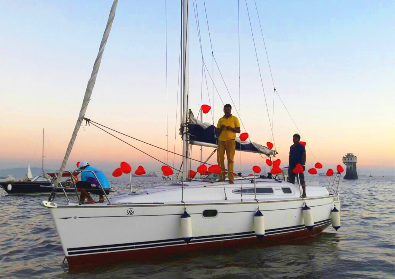 Guests on a sailing boat deck, Mumbai harbour