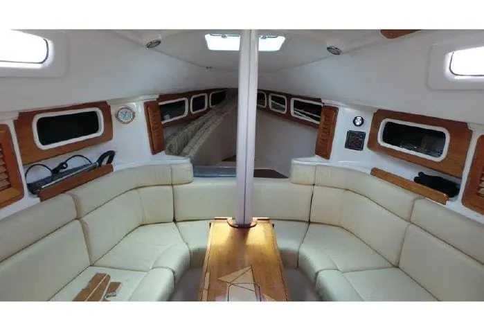 Sheltered, cushioned cabin interior of a Kasimi sailing boat